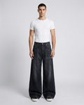 Big Easy Jeans Night Bloom on model — mega baggy fit covering sneakers
