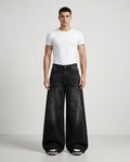 Session Jeans Graffiti Black on model — mega baggy fit covering sneakers