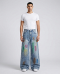 Easy Jeans Paint Splash on model — mega baggy fit covering sneakers