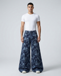 Maxout Jeans Ink Cloud on model — mega baggy fit covering sneakers