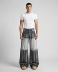 Big Easy Jeans Gradient Dusk on model — mega baggy fit covering sneakers