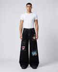Maxout Jeans Obsidian on model — mega baggy fit covering sneakers