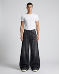 Easy Jeans Midnight Fade on model — mega baggy fit covering sneakers