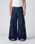 Cooper Jeans Lumber Wash on model — mega baggy fit covering sneakers