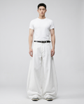 Cooper Jeans Salt White on model — mega baggy fit covering sneakers