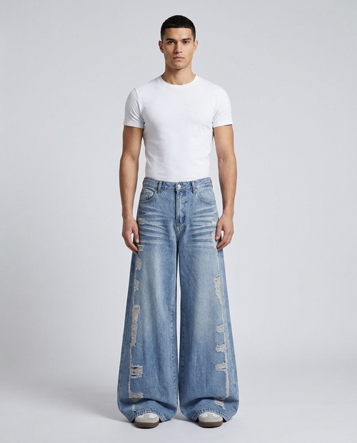 Big Easy Ripped Jeans Harbor Blue on model — mega baggy fit covering sneakers