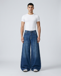 Cooper Jeans Delta Blue on model — mega baggy fit covering sneakers