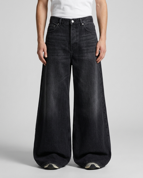 Big Easy Embroidered Jeans Halo Fade on model — mega baggy fit covering sneakers