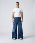 Maxout Embroidered Jeans Dragon Blue on model — mega baggy fit covering sneakers