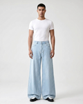 Easy Jeans Sky Stripe on model — mega baggy fit covering sneakers