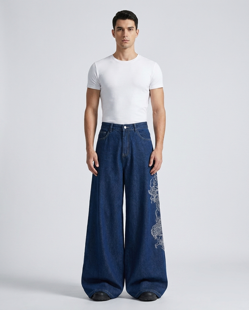 Big Easy Embroidered Jeans Imperial Blue on model — mega baggy fit covering sneakers