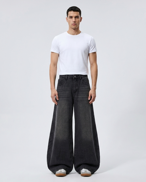 Big Easy Jeans Gunmetal on model — mega baggy fit covering sneakers