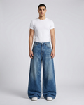 Easy Jeans Worn Indigo on model — mega baggy fit covering sneakers