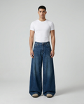 Cooper Jeans Current Blue on model — mega baggy fit covering sneakers