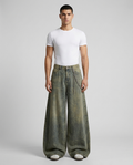 Boulevard Distressed Jeans Dust Bowl on model — mega baggy fit covering sneakers