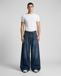 Boulevard Embroidered Jeans Dark Halo on model — mega baggy fit covering sneakers