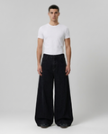Cooper Jeans Horseshoe on model — mega baggy fit covering sneakers