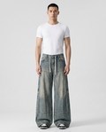 Easy Jeans Vintage Coal on model — mega baggy fit covering sneakers