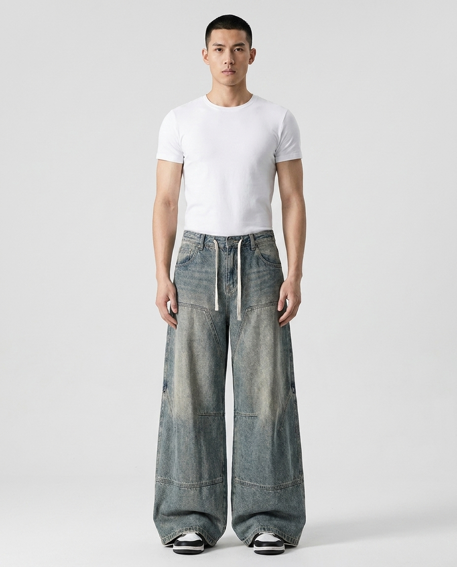 Easy Jeans Vintage Coal on model — mega baggy fit covering sneakers