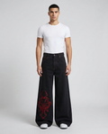 Session Embroidered Jeans Skull Ash on model — mega baggy fit covering sneakers