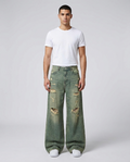 Slack Ripped Jeans Open Air on model — mega baggy fit covering sneakers