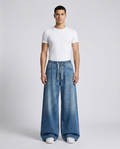 Easy Jeans Weekend Fade on model — mega baggy fit covering sneakers