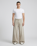 Easy Jeans Raw Hem Fade on model — mega baggy fit covering sneakers