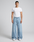 Maxout Jeans Blank Fade on model — mega baggy fit covering sneakers