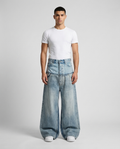 Easy Jeans Layered Patch on model — mega baggy fit covering sneakers
