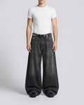 Maxout Embroidered Jeans Fossil Fade on model — mega baggy fit covering sneakers