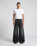 Session Embroidered Jeans Marker Fade on model — mega baggy fit covering sneakers