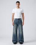Foreman Jeans Dock Blue on model — mega baggy fit covering sneakers