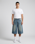 Slack Denim Shorts Coast Fade on model — baggy wide-leg jorts