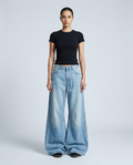 Women's Baggy Jeans Powder Blue on model — mega baggy fit covering shoes
