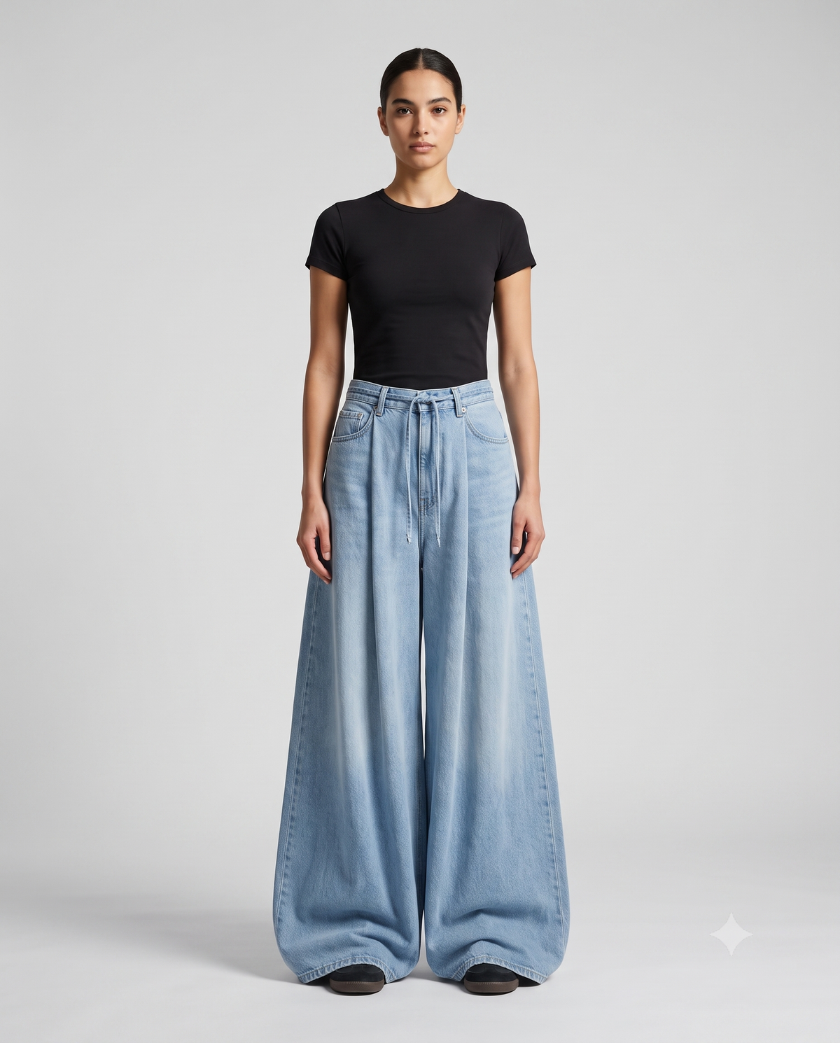 Women's baggy jeans on model — relaxed wide-leg denim covering the shoes, The Baggy Jeans Co.